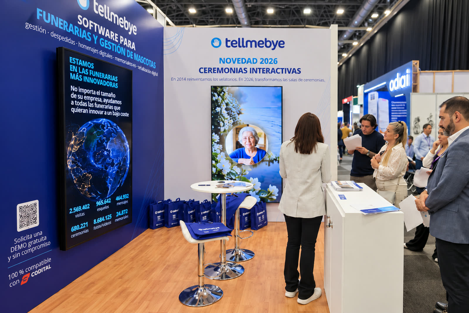Estand de Tellmebye en FUMEXPO 2026, en Guadalajara, con el cartel Novedad 2026 Ceremonias Interactivas y un grupo de visitantes siguiendo la presentación.